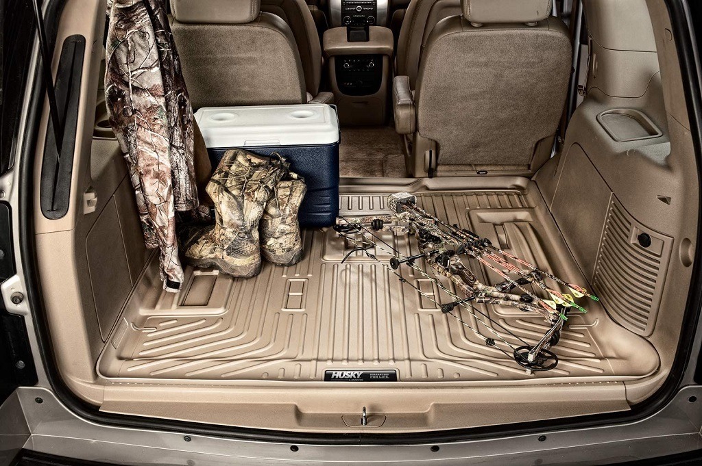 Husky Cargo liner shown inside vehicle with hunting gear